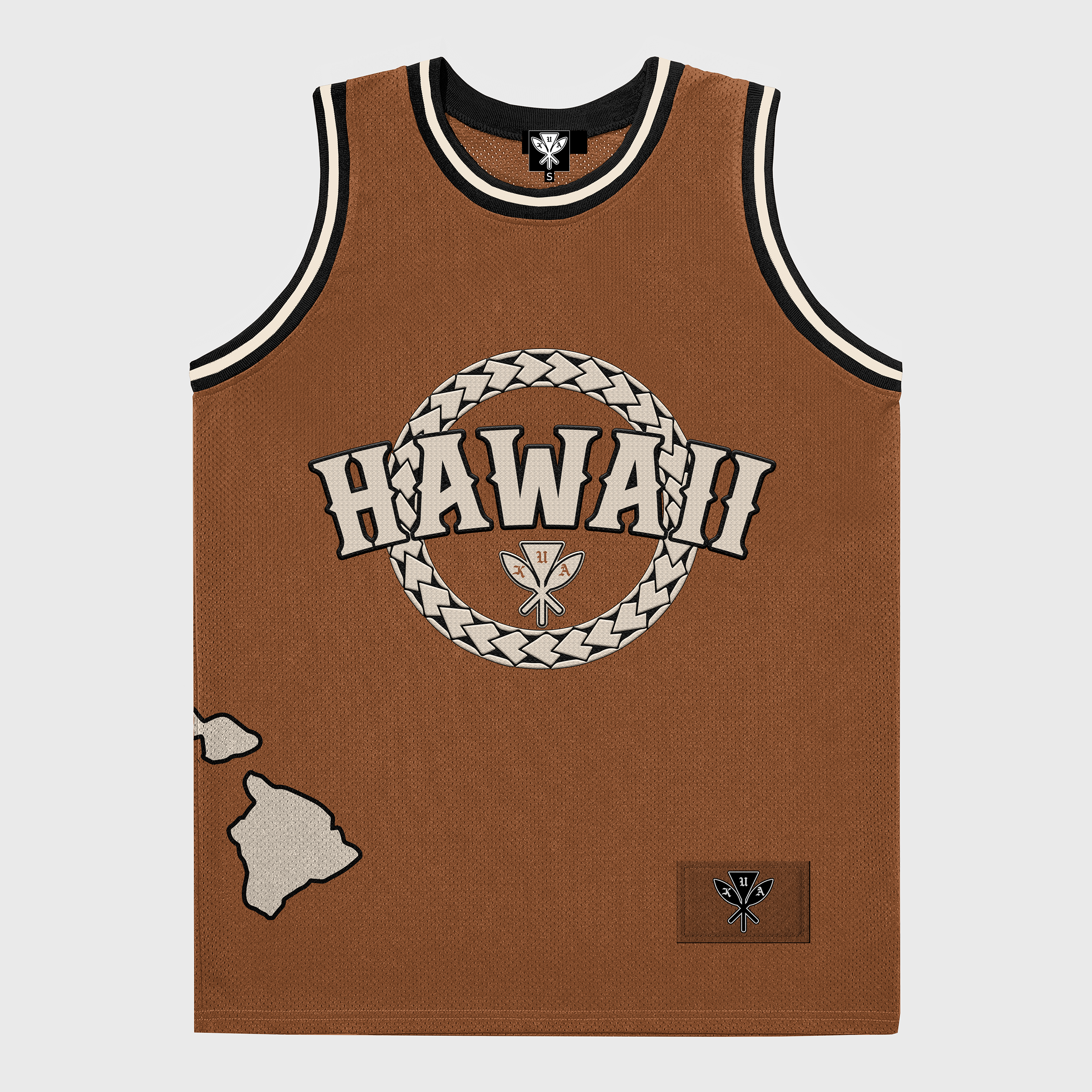 A brown basketball jersey with 'HAWAII' written in circle tribal embroidery at the front, along with tribal patterns and a Hawaiian island chain at the bottom left. A silicone patch is visible at the lower right.