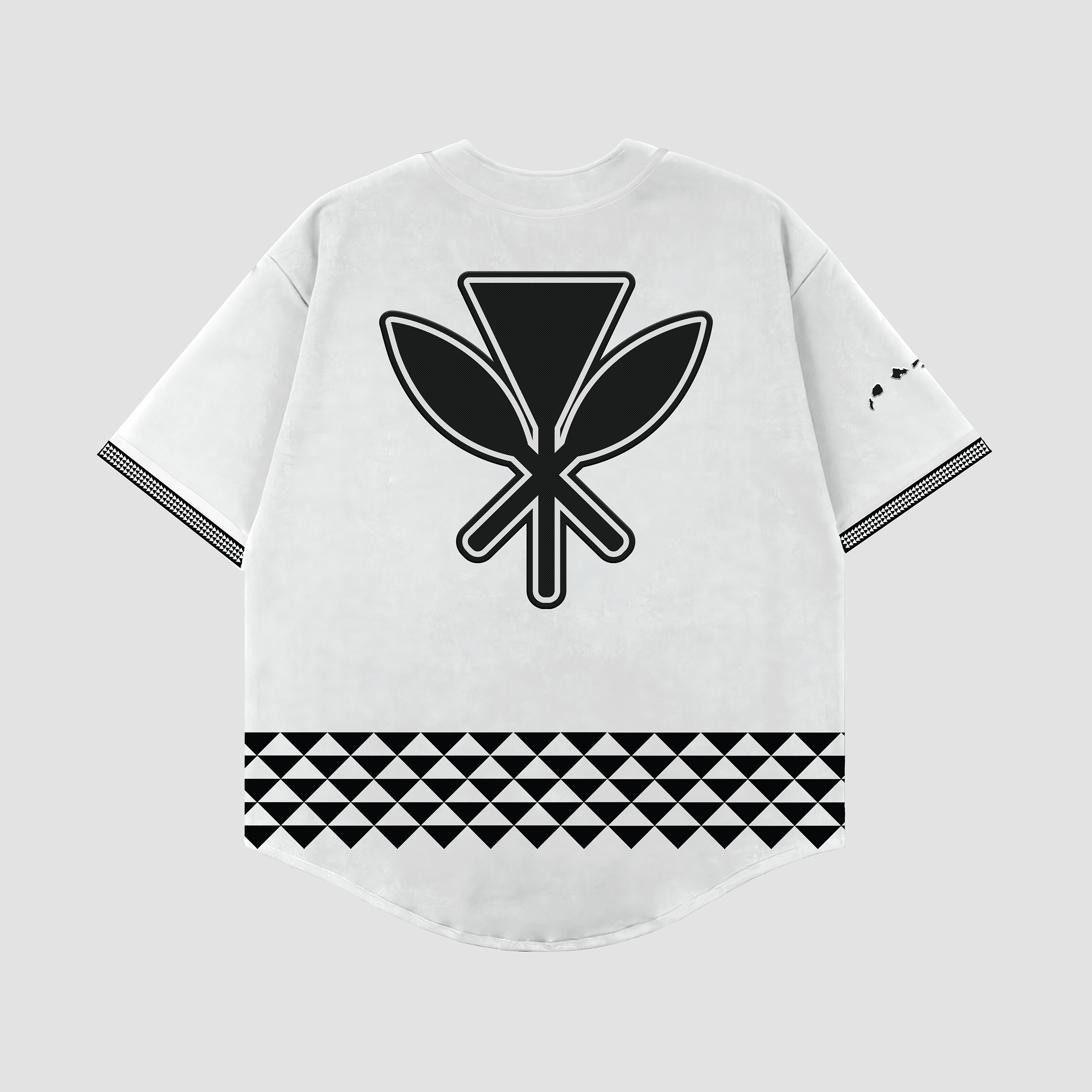 A white baseball jersey with 'Hawaii' written across the chest in bold old English lettering, featuring tribal patterns on the lower half and embroidered logos on the shoulders and sleeves.